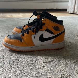 Yellow and black Air Jordan 1s big kids